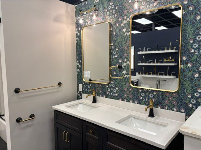 Display bathroom vanity with double sink and mirrors at Weinstein Reading